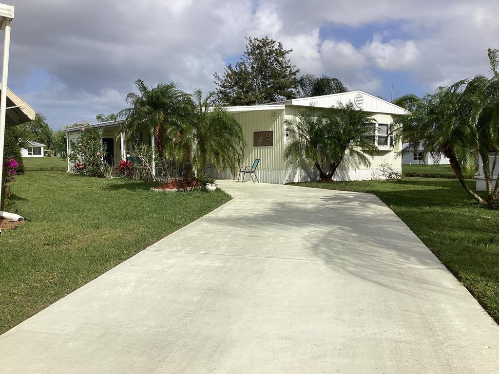 Photo of 7 La Paloma Lane, Port Saint Lucie, FL 34952 (MLS # R10975181)