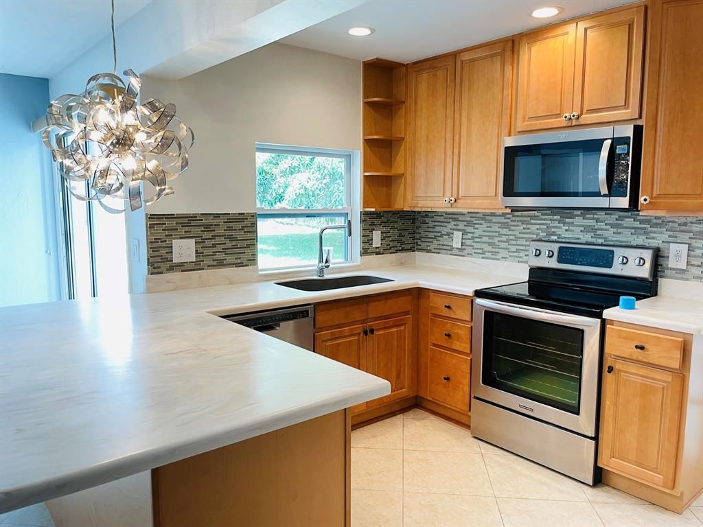 Photo of 133 NE Surfside Avenue, Port Saint Lucie, FL 34983 (MLS # R10715741)