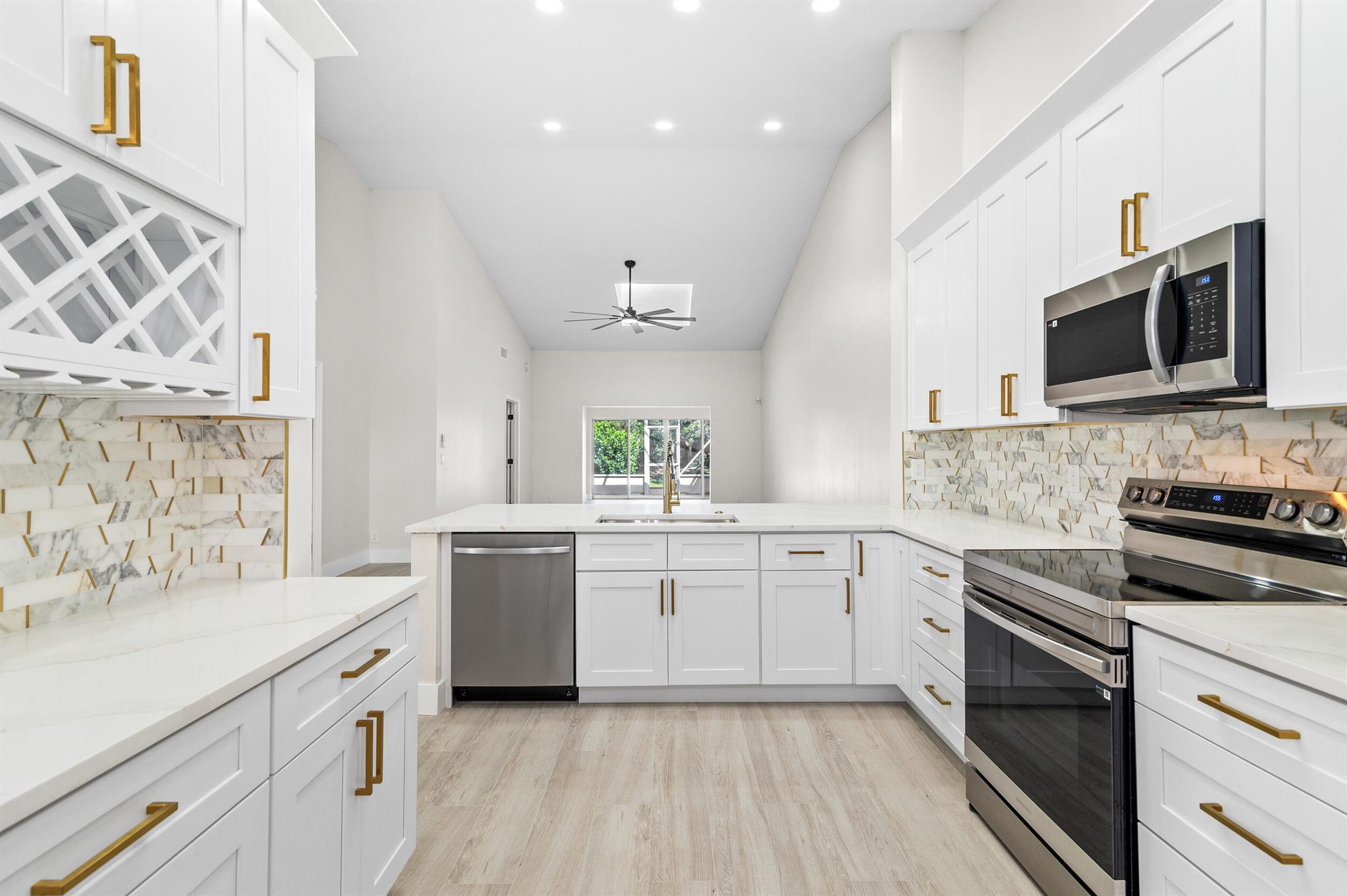 Beautifully remodeled villa style 2 bedroom 2 bath with large office that could easily made into 3rd bedroom. Located at end of cul-de-sac. New plank tile flooring. Shaker white cabinets in kitchen and bathrooms. quartz countertops. This is a must see. HOA includes roof, exterior paint, landscaping, water, cable, home security system. 7 million dollar clubhouse remodel that will be finished this year and the best part is current owner is paying assessments. Multiple pools, tennis courts and tons of activities for residence.