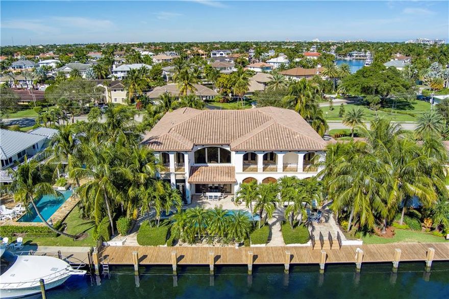 Stately Deepwater Palazzo sited on 90’ of waterfrontage with spell-binding southern views on the Fraser Waterway near the confluence of the Hillsboro Bayou just minutes to the Intracoastal. Created with remarkable detailing and craftsmanship throughout, this luxe estate features an array of amenities including gourmet chef’s kitchen, light-filled interiors, impressive two-story living room with fireplace, theatre room, executive office, elevator, impact windows and more. Impressive 2nd level primary suite with private waterfront balcony, spa-like baths, jetted tub and massage room. Outdoor entertainment is enjoyed at the resort-style infinity edge pool with spill over spa. This remarkable estate is also ideal for the avid boater sited just minutes to the Hillsboro Inlet and ocean beyond.