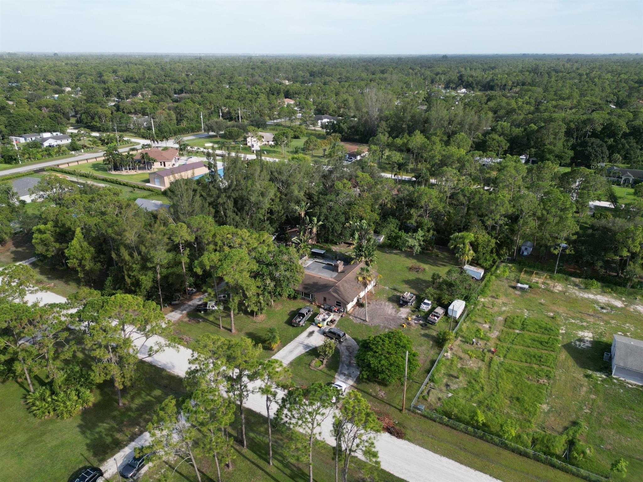 Absolute Bargain, Unbelievable Price Priced Low and firm for your Pre Approved buyer that wants a home in THE ACREAGE This 2181 Sq Ft Living 3300 Sq Ft under roof 4 Bed 2 Bath Split Design CBS Construction Home on 1.15 Acres Needs TLC and Has Great Potential.Has additional 700 SQ Ft CBS Garage Shop area. and Pool Has Impact Windows and Doors. Ready for your ideas. Don't miss out on this golden opportunity to live in the Acreage.