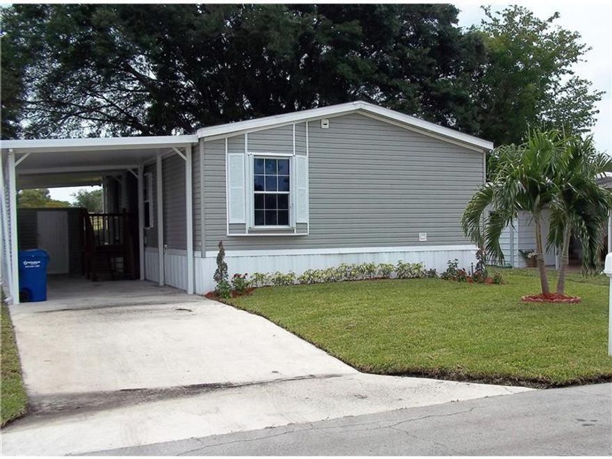 beautiful 2006 mobile home with golf course view. Home features new platinum appliances, new wood floors thru out, drywall walls, screen porch over looking golf course, storage shed and carport. Rare find! wont last long!