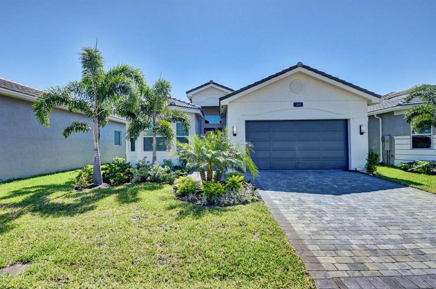 Immaculate 1 story, barely lived in popular Bimini model with great room design on the lake.  Spacious and bright home, with extended wrap around patio, with neutral colors and many upgrades by the builder and after.  Easy to start decorating this beautiful home. As you walk, from the widened walkway, thru the glass entry doors you will see: designer kitchen with quartz counters, upgraded flooring, motorized blinds, extra recessed lighting, walk-in closets, linen pantry in 2 baths, quartz counters in baths, impact glass, master has tray ceiling, and much more. Enjoy the rear yard with a special serene lake view. Come live the dream life of Valencia Bay. Amenities: resort style pool, resistant pool, tennis, pickleball, bocce ball, billiards, café, full service outdoor bar, card rms, & mor