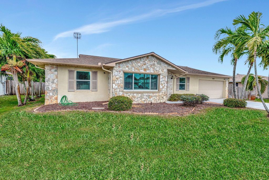 Photo of 661 SE Crescent Avenue, Port Saint Lucie, FL 34984 (MLS # R11069410)