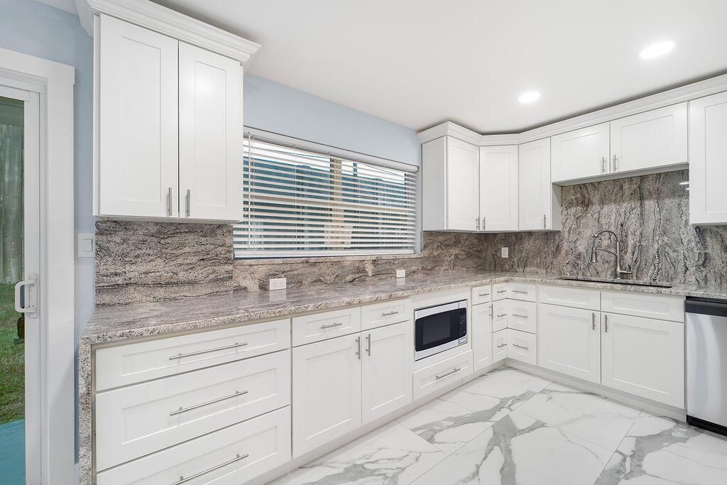 Photo of 9446 Birmingham Drive, Palm Beach Gardens, FL 33410 (MLS # R10919625)