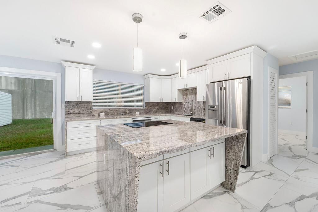 Photo of 9446 Birmingham Drive, Palm Beach Gardens, FL 33410 (MLS # R10919625)