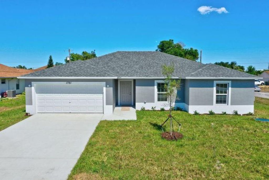 Photo of 3710 SW Swope St, Port Saint Lucie, FL 34953 (MLS # F10329629)