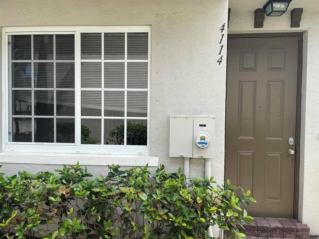 Photo of 4114 Napoli Lake Drive, Riviera Beach, FL 33410 (MLS # R10711597)