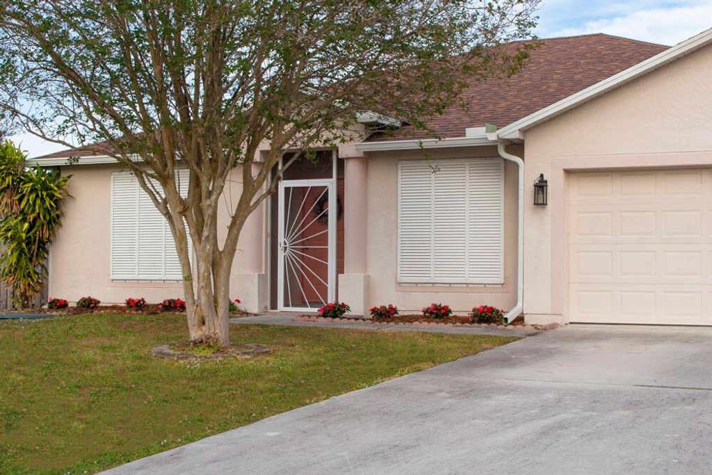 Photo of 1019 SE Euclid Lane, Port Saint Lucie, FL 34983 (MLS # R11088530)
