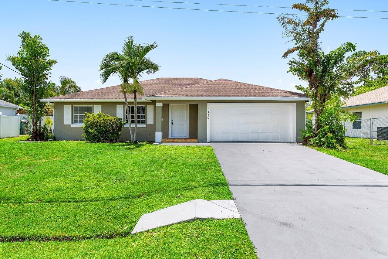 NEW ROOF! Renovated 3 bedroom, 2 bathroom CBS home featuring a stunning new kitchen with white cabinets, granite countertops, and stainless steel appliances. Bathrooms have been beautifully updated with new vanities, tile, and fixtures. Enjoy luxury flooring throughout, offering a modern and cohesive feel. Brand new AC provides comfort and efficiency year-round. Move-in ready with stylish upgrades throughout!