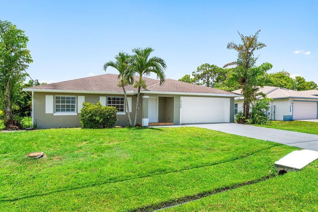 Photo of 3170 SW Bridge Street, Port Saint Lucie, FL 34953 (MLS # R11108529)