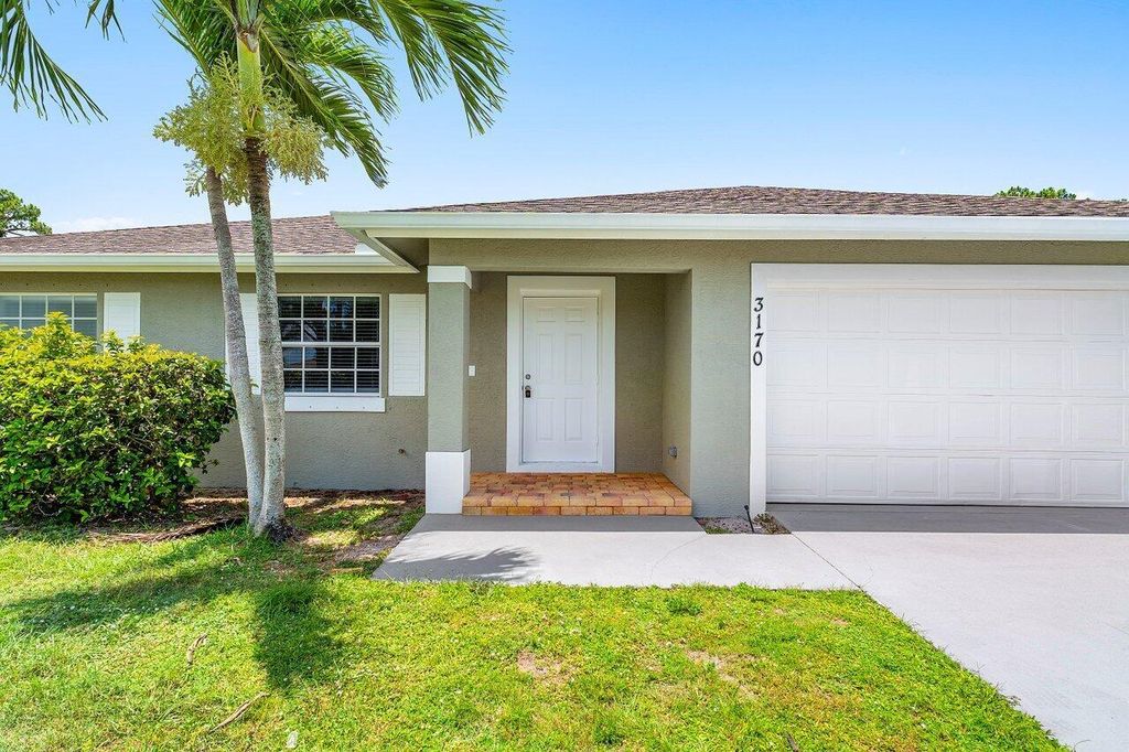 Photo of 3170 SW Bridge Street, Port Saint Lucie, FL 34953 (MLS # R11108529)