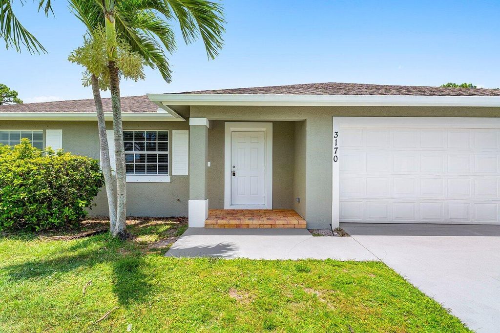 Photo of 3170 SW Bridge Street, Port Saint Lucie, FL 34953 (MLS # R11108529)