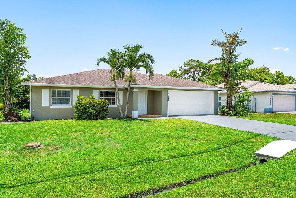 Photo of 3170 SW Bridge Street, Port Saint Lucie, FL 34953 (MLS # R11108529)