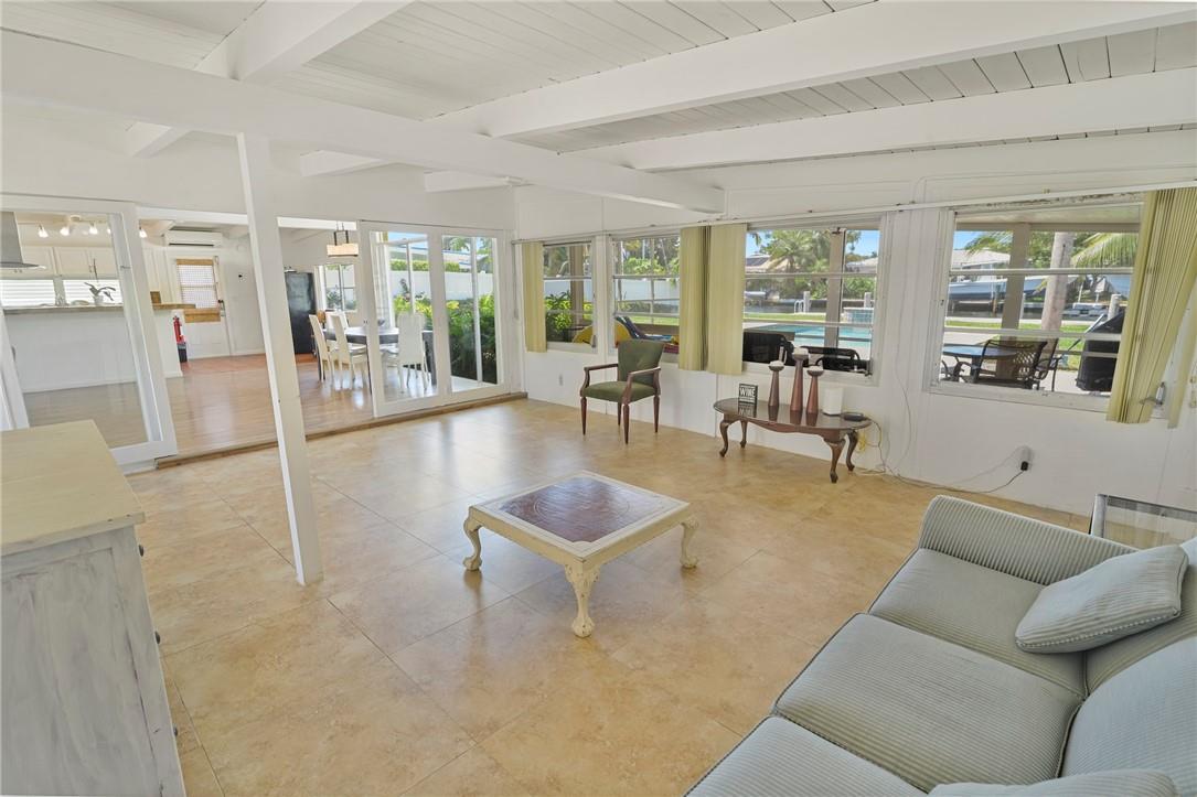 LIVE AT THE BEACH! Private Dock and NO FIXED BRIDGES to the Ocean. Available Sept. 10. Deepwater single family home. 1 block from the sand. 1950's style. Wide-Open Floor Plan. Florida living the way it used to be. Quiet Private Road. Huge backyard, pool, big, screened porch and newer private dock. Spend your afternoons at the vast, locked private beach at the end of the street, with palm grove, shelters, and barbecue grills. Home is on a 10,000 plus square foot lot with 70 feet on deepwater. Tile and laminate floors. Washer and Dryer. Each room is individually cooled by a quiet, efficient mini-split system. THIS HOME IS PERFECT FOR THE BEACH LOVING BOATER!