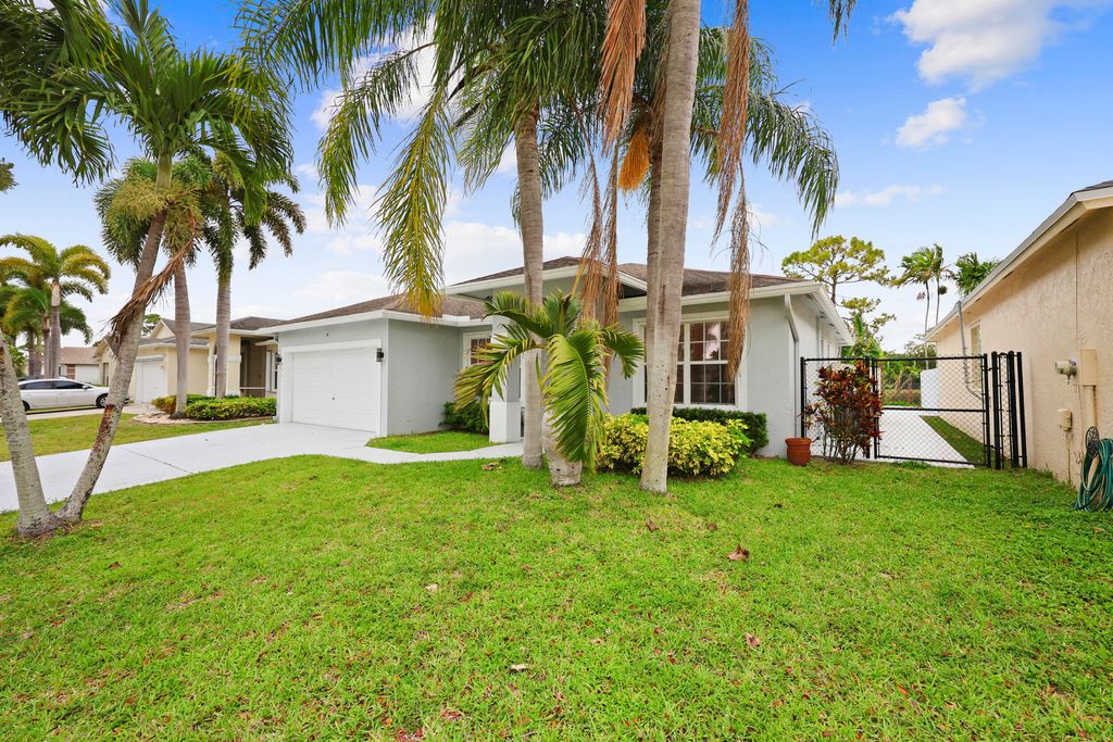 Photo of 1209 Olympic Circle, Greenacres, FL 33413 (MLS # B26020108)