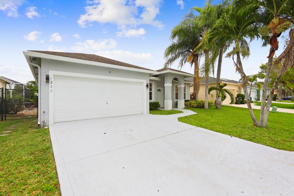 Photo of 1209 Olympic Circle, Greenacres, FL 33413 (MLS # B26020108)
