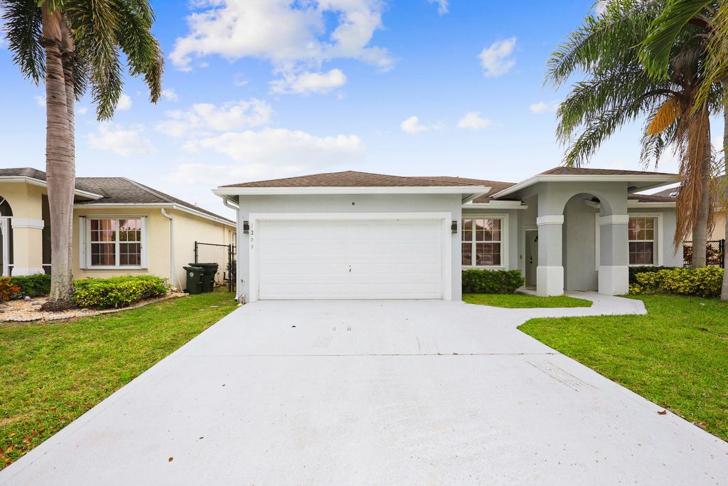Photo of 1209 Olympic Circle, Greenacres, FL 33413 (MLS # B26020108)