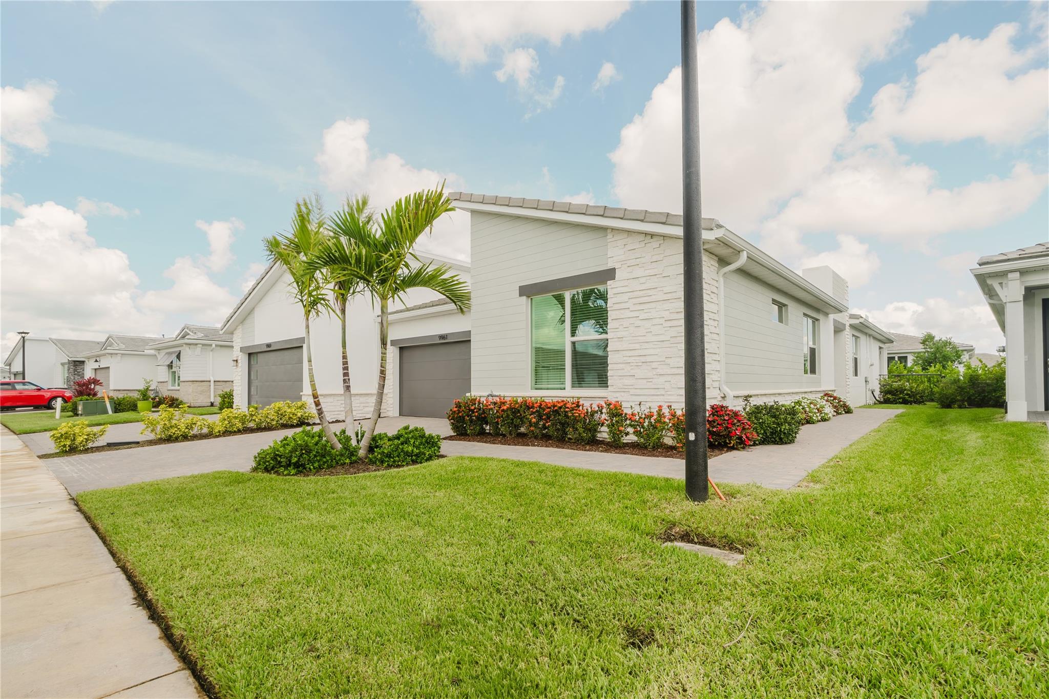 Enjoy resort-style living with this brand-new construction, energy efficient 2 bedroom + Den and 2-bathroom villa located in the gated community of Tradition at Telaro. Great finishes and features throughout, including: a spacious and open floor plan, complete impact glass storm windows, and a covered and screened patio. Del Webb offers its residents an active 55+ lifestyle and amenities that include access to a clubhouse and pool, a fitness center and spa, pickle ball, tennis, bocce ball courts, and many community-hosted activities with Lifestyle Coordinator - all included in the rent payment. The rent payment also includes cable, high-speed internet, landline, alarm monitoring, water for irrigation, and lawn maintenance.