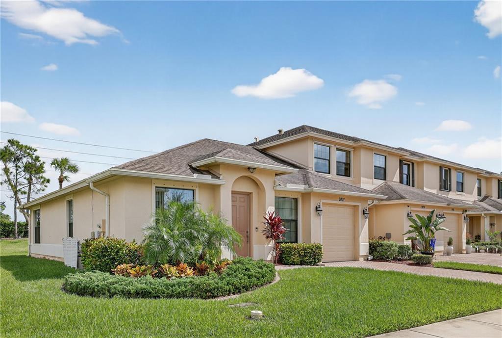 Meticulous 3BR/2BA villa in a sidewalk community. Open concept with ceramic tile throughout, living room, family room, and patio overlooking a spacious back yard. Kitchen flows to dining and gathering spaces. Primary suite offers walk-in shower and double vanity. Air-conditioned garage with laminate flooring and custom shelving. Hurricane shutters, reverse osmosis water system, and hybrid water heater add comfort. Community amenities include pool, tennis, basketball, playground, and more. Close to shopping, dining, and beaches.