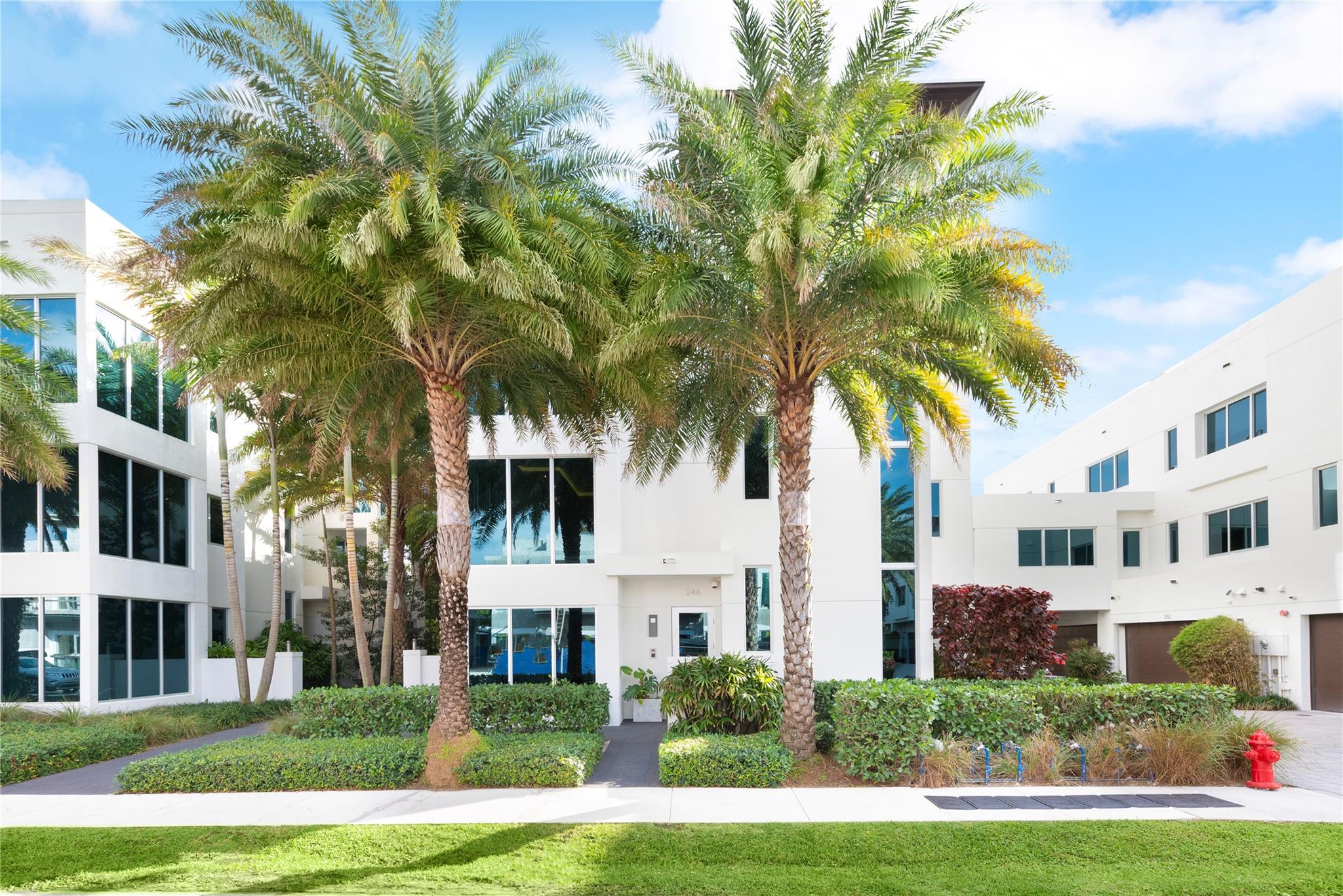 Gorgeous corner townhome. Soon to be gated complex. Floor to ceiling impact windows allow billowing natural light! Floating Staircase. Private Glass Door Elevator-garage to 800 sqft rooftop w/summer Kitchen & Ocean, Skyline & Intracoastal views. German made Hacker cabinets w/Wolf & Sub Zero appl & Quartz Counters. Italian Porcelain Floors. 10’ Ceilings. Steven G designed. Oversized primary bdrm w/dual closets & LG luxurious bath. ~$200,000 upgrades: Control4 SmartHome System w/Speaker System, Media, Lighting, Auto Shades, Security etc. Sprinkler system thruout. 2 Car Gar. Infinity Pool & Jacuzzi view down canal to Intracoastal. Low HOA. 2 pets & rental OK. High efficiency home. Teco gas piped in. 35' dock available to be purchased.