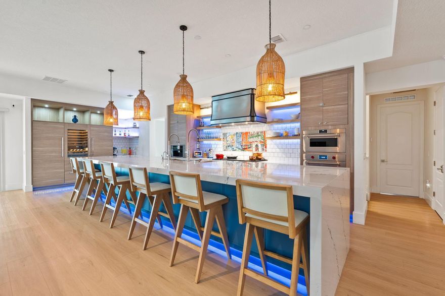 Ocean access waterfront combined w/ PSL's most upgraded kitchen & home theater. Where custom design, world-class technology & refined luxury converge. This impeccably crafted 4BR/4BTH concrete-block estate delivers a lifestyle experience unlike anything on the market. At the heart of the home is bespoke kitchen w/ custom ultracraft cabinetry & an 18ft island w/ Cambria - Inverness Cobalt quartz. A true culinary masterpiece equipped with over $90,000 in Sub-Zero, Wolf, Miele, True, U-Line & Sharp appliances. Dual 30'' Sub-Zero refrigerator/freezer columns, Sub-Zero wine tower, Wolf 60'' dual-fuel range, Wolf steam oven, Wolf wall oven, double Miele dishwashers, a built-in Miele coffee system, True drawer refrigeration, a Sharp microwave drawer & more make this an entertainer's dream.