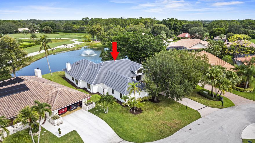 Enjoy sweeping lake & golf course views from this fully renovated estate in the gated  community at PGA National. This 4-br/ 4.5-ba/3 car home is designed for effortless indoor-outdoor living, with bright open spaces flowing to a resort-style pool, marble paver patio, & covered outdoor lounge. The private primary suite offers serene water views, a sitting area, custom walk-in closet, & a spa-inspired bath with soaking tub &  curbless shower. At the center of the home, the chef's kitchen features custom cabinetry, quartz countertops, a waterfall island, & premium Café appliances. With a new tile roof, impact windows &  doors, newer A/C systems, &  designer finishes throughout, this move-in ready home combines modern luxury all within one of Palm Beach Gardens most desirable golf communities