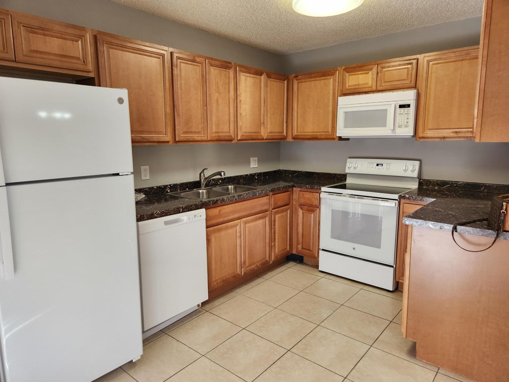 Photo of 1749 N Congress Avenue #C, West Palm Beach, FL 33401 (MLS # B26043229)