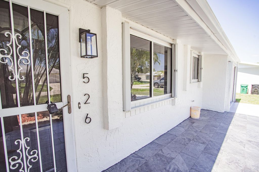 Photo of 526 NW Avon Avenue, Port Saint Lucie, FL 34983 (MLS # R10992581)