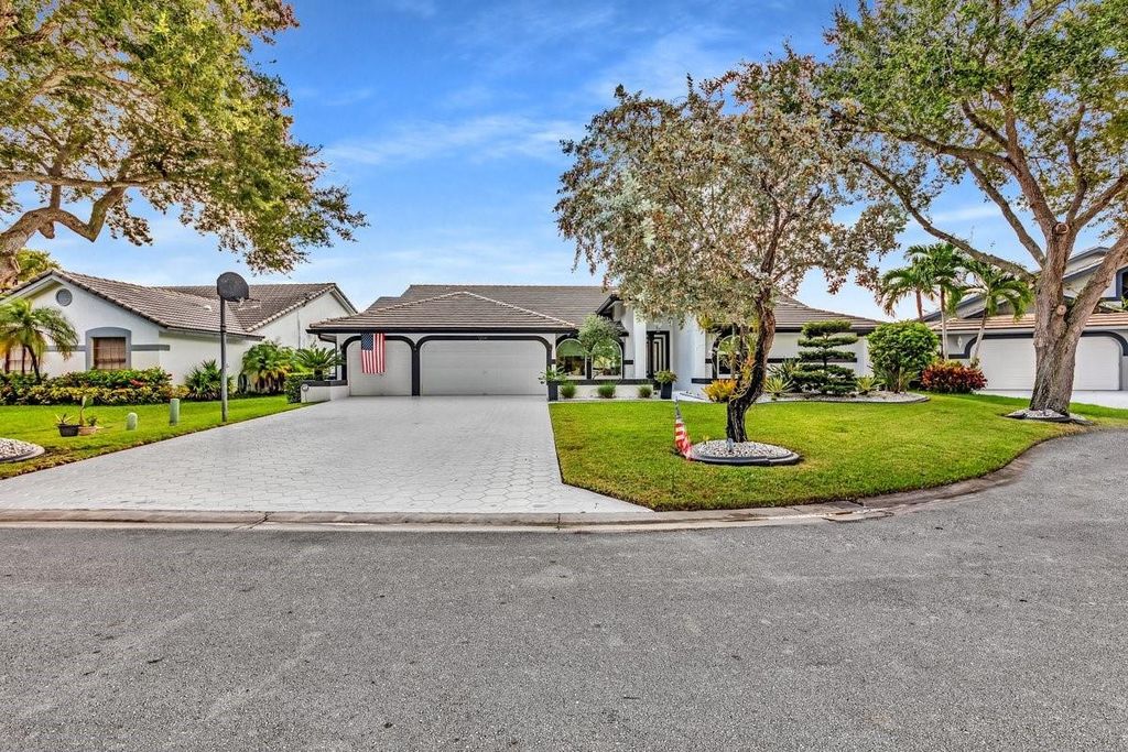 Photo of 12041 NW 2nd Drive, Coral Springs, FL 33071 (MLS # B26000135)