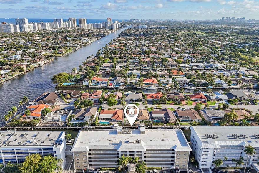 Experience refined coastal living in this fully upgraded residence just steps from Lauderdale-by-the-Sea with dockage. Enjoy breathtaking, unobstructed southern views of the water and downtown skyline from sunrise to sunset. This immaculate home features impact windows and doors, custom millwork, and wide-plank porcelain flooring throughout. The custom kitchen boasts an oversized island, built-in coffee/wine bar, double oven, and upper-tier LG appliances. Retreat to the spacious primary suite with custom closets, or host guests with custom Murphy bed set up. 1-deeded underground parking space + guest, & storage. The boutique building offers a new seawall, dock, concrete restoration, roof updates, and a refreshed pool area. A true live-work-play oasis just steps to dining, golfing, & fun! Welcome to an unparalleled standard of luxury living, perfectly positioned on a quiet dead-end street just moments from the charming, character-filled beach town of Lauderdale-by-the-Sea. This meticulously upgraded residence offers an exceptional coastal lifestyle, blending relaxed sophistication with refined elegance. From the moment you enter, you are greeted by breathtaking, unobstructed southern views that capture everything from vibrant sunrises to the dazzling downtown skyline and serene water vistas.  Exquisite Interior Craftsmanship Every detail of this home has been thoughtfully curated to impress the most discerning buyer. The residence is fortified with impact windows and doors throughout, ensuring both peace of mind and whisper-quiet interiors. Custom window treatments, solid wood interior doors, and baseboards complement the smooth, flat-finish ceilings and walls. Custom millwork and wide-plank (approx. 12") high-end porcelain wood-look flooring flow seamlessly through the space, illuminated by a fully updated electrical system with recessed lighting.  A Culinary Dream The custom kitchen is a true centerpiece, designed for both intimate dinners and grand entertaining. It features an oversized island with a separate full-size sink, a built-in coffee and wine bar area, and custom cabinetry with convenient pull-outs throughout. The double oven and upper-tier LG appliance package complete this chef's haven.  Luxurious Accommodations The spacious primary suite is a private sanctuary, complete with custom-built closets that provide ample storage. The guest bedroom or office features a custom-built queen-size Murphy bed with integrated storage, perfect for flexible guest accommodations. The bathrooms are equally impressive, showcasing Kohler sinks and toilets, Moen plumbing fixtures, and custom wood cabinetry.  Modern Convenience & Peace of Mind This residence is equipped with a separate laundry room featuring an LG Inverter Direct Drive washer and dryer. Comfort and efficiency are guaranteed with a 2017 HydroTech water-source HVAC heat pump system and a Bradford White Hydrojet Total Performance hot water heater. Additional conveniences include a deeded underground garage parking space (#12) and private, secure storage on the first floor.  Unrivaled Building Amenities Residing in this financially sound boutique building means enjoying extensive, recently completed improvements. All milestone inspections are complete, and assessments are paid in full. The building boasts a secured entrance leading to a welcoming lobby with immediate elevator access. Recent upgrades include a brand-new concrete seawall and dock spanning the entire property, concrete restoration, roof updates, and a beautifully refreshed pool area nearing completion. Residents also enjoy access to a waterfront recreation and party room with a kitchen.  Discover a true live-work-play environment where effortless access to dining, boutique shopping, entertainment, and miles of wide white sand beaches awaits. This is more than a home; it is a lifestyle destination.