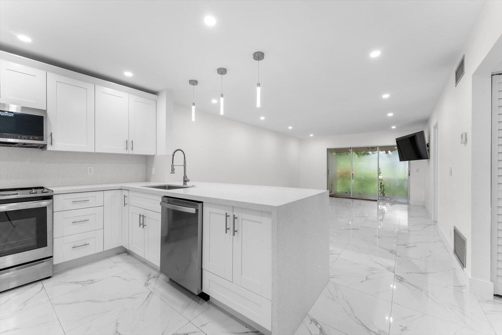 Photo of 265 Cape Cod Circle, Greenacres, FL 33467 (MLS # R11116874)