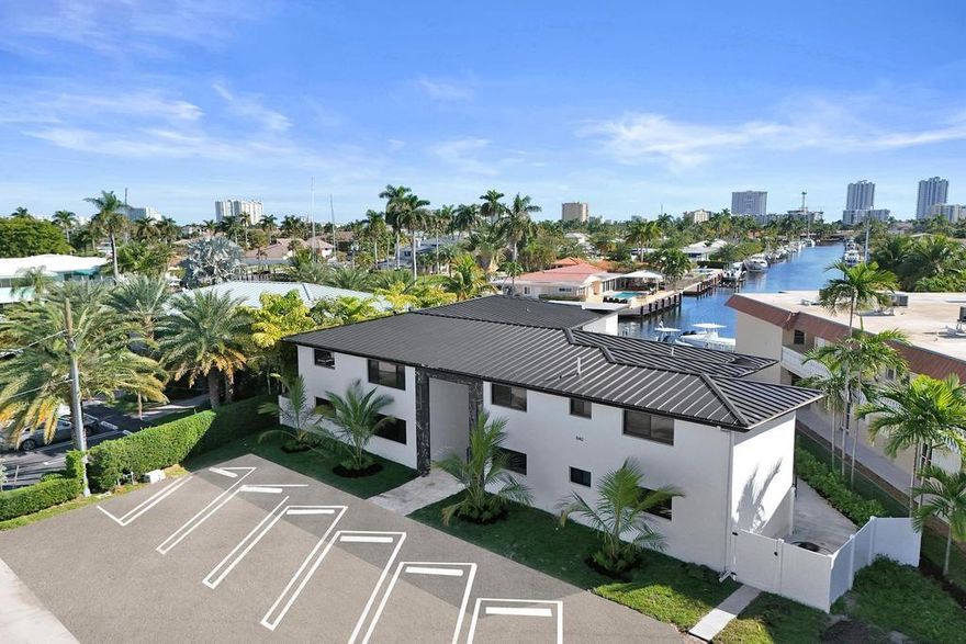 A sleek, newly renovated 2-bed, 2bath retreat designed for the modern professional. Nestled on a serene canal with direct water access, this home blends sophistication, convenience, and coastal charm. Inside, a fully updated interior features high-end finishes, an open layout, and abundant natural light. The contemporary kitchen boasts premium appliances, quartz countertops, and custom cabinetry—perfect for entertaining or unwinding. Both bedrooms offer ample space and stylish en-suites for a private sanctuary. Outside, enjoy your own dock with easy water access for boating, paddleboarding, or soaking in the views. Minutes from trendy restaurants, upscale shopping, and pristine beaches, this home offers the perfect work-life balance.