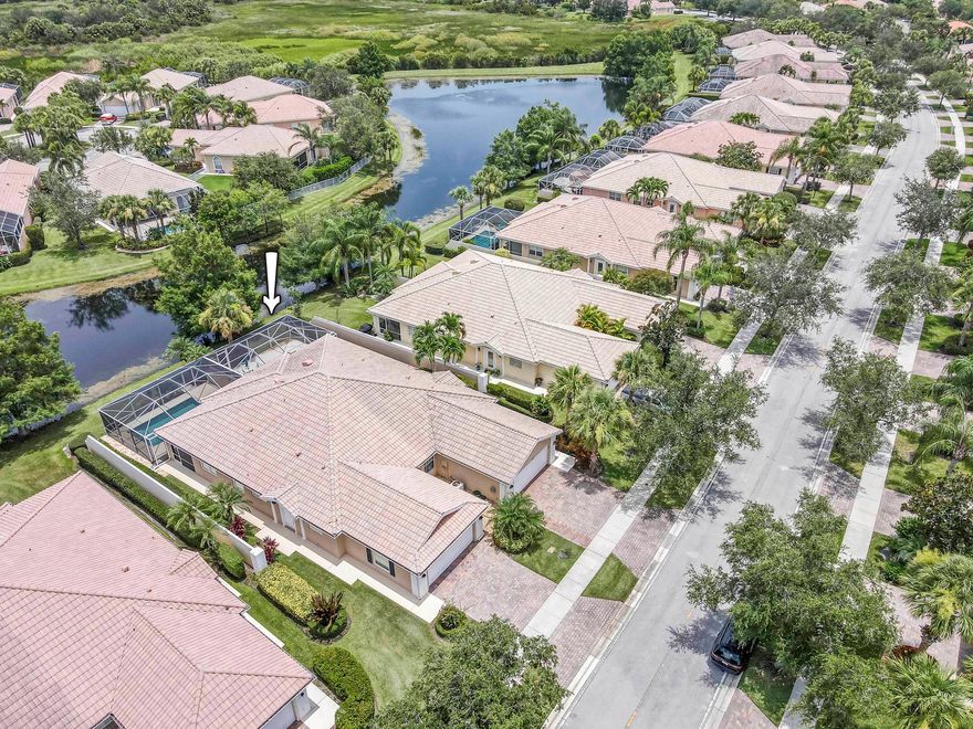 Meticulously maintained 2/2 lakefront villa in the desirable DiVosta built community, The Lakes at Tradition. This villa features an oversized screen patio with long sweeping views of the gorgeous lake. This extended model boasts an open floor plan and has two private bedroom suites with walk in closets. The kitchen features 42' cabinets with corian counters and tile backsplash. Some of the many other features of this home include: Brand new AC, tile flooring throughout with exception of bedrooms which have laminate flooring, barrel tile roof, paver driveway, plantation shutters, updated primary bathroom, central vacuum, walk in closets with built-in shelving, plus much more. The community amenities include: recreational facilities, clubhouse, lighted tennis courts and pickleball court