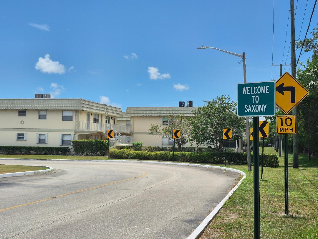 Welcome to carefree resort-style living! Furnished or Unfurnished 1 bedroom, 1 bathroom condo with private half-bath for guests in the Saxony O section of 55+ Kings Point in Delray Beach. This second-floor corner unit is filled with natural light and features wood-look flooring, a very spacious bedroom, and an updated kitchen with ample cabinets, recessed lighting, and a convenient pass-thru to the dining area. Start your mornings on the enclosed screened balcony, ideal for coffee and quiet moments. Separate laundry room with full-size washer, dryer, and shelving for extra storage. Enjoy amenities like golf, tennis, multiple pools, fitness centers, a clubhouse, theater, bistro, game rooms, and a courtesy shuttle. Gated entry w 24-hour security. near shopping, medical centers and the beach