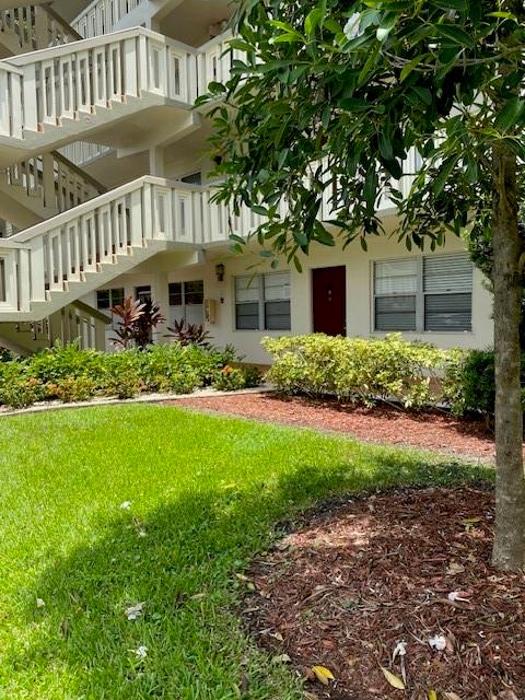 Large annual 2/2 Rental available for 11/1/25. Freshly painted and new flooring. 1st floor entry and back door to large enclosed patio and door out to canal. Lovely water views. All the amenities that WYNMOOR Country Club offers, 55 plus community. 1st parking spot by stairs makes everything EZ.