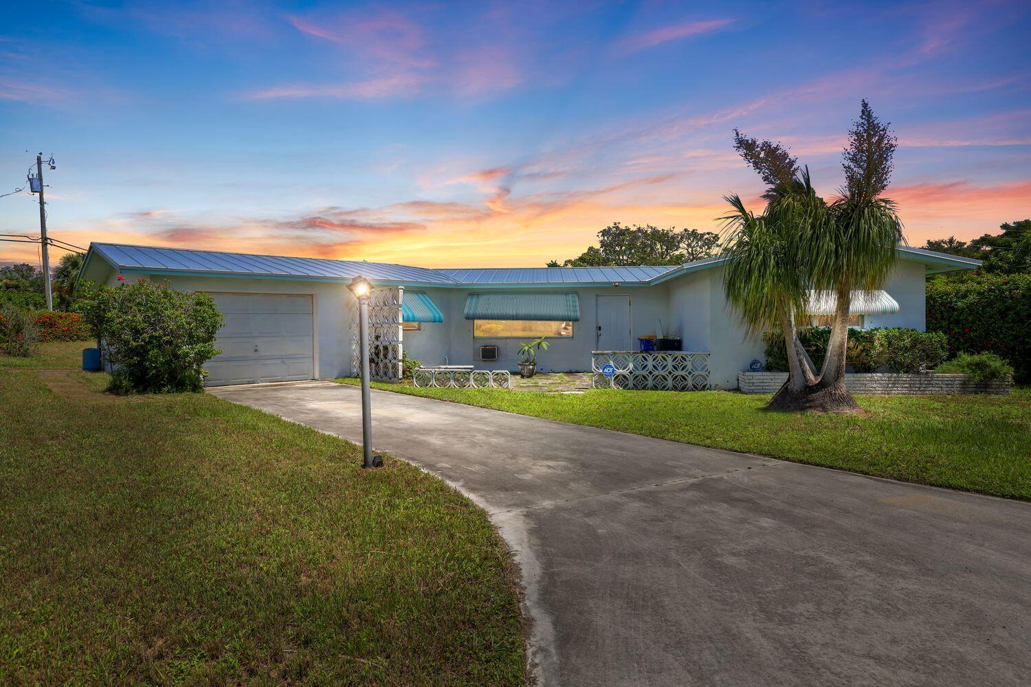 Welcome Home! This charming 2-bedroom, 2-bath home with a Florida room is nestled in the highly desirable Hobe Hills neighborhood. Enjoy peace of mind with a brand new 2025 metal roof, 2025 water heater, and a 2013 A/C. Situated on a spacious corner lot, there's plenty of room to spread out -- and with NO HOA, you can bring your boats, RVs, or toys with ease. Whether you're relaxing in the Florida room or taking advantage of the freedom this property offers, this is the perfect place to call home.