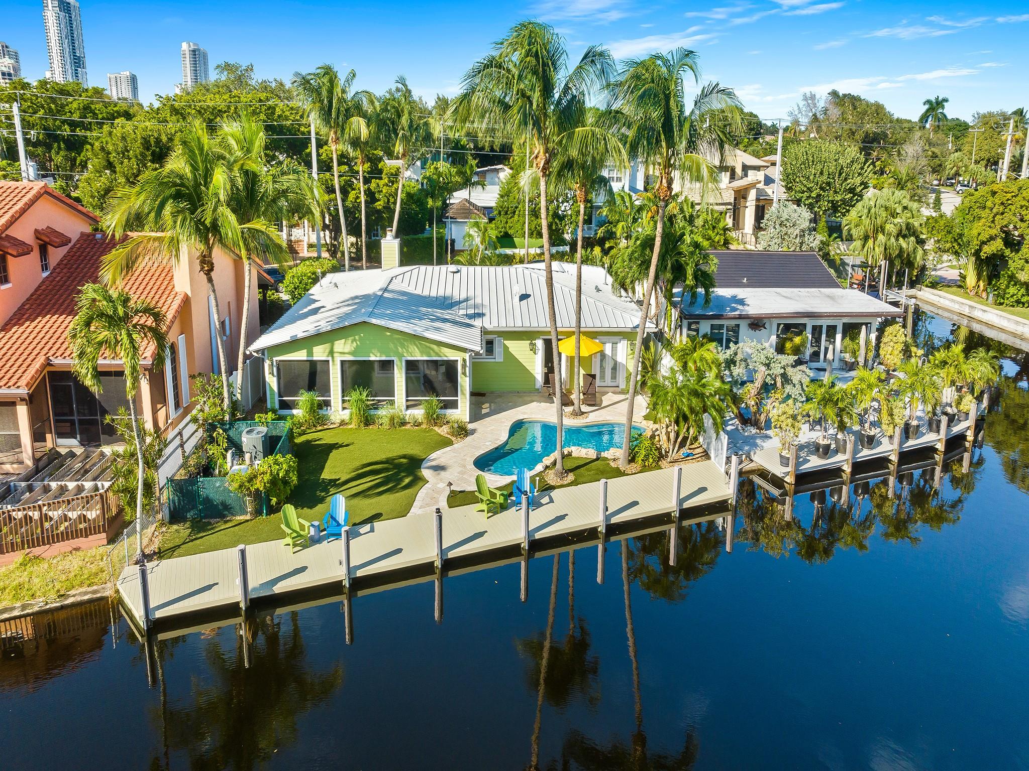 Stunning 3 Bed/2 Bath Key West-inspired home, blending coastal charm w/high-end luxury on a spacious 73' WF lot along the Tarpon River w/direct ocean access & 1 fixed bridge. Upon entry an open layout flows seamlessly into an entertainer’s dream kitchen (2023 reno) w/Thermador appliances including gas cooktop & range. A gas fireplace in the living room, surrounded by custom cabinetry, adds warmth & character to the living space. Serene owner's suite w/French doors, has a walk-in steam shower for a true spa experience at home! Expansive screened back porch provides a perfect setting for morning coffee and/or sunset views. New TREX dock (2020), 2-car garage, pantry/laundry, custom pool w/water feature, artificial turf & full house generator add to the lifestyle only Rio Vista can offer!!