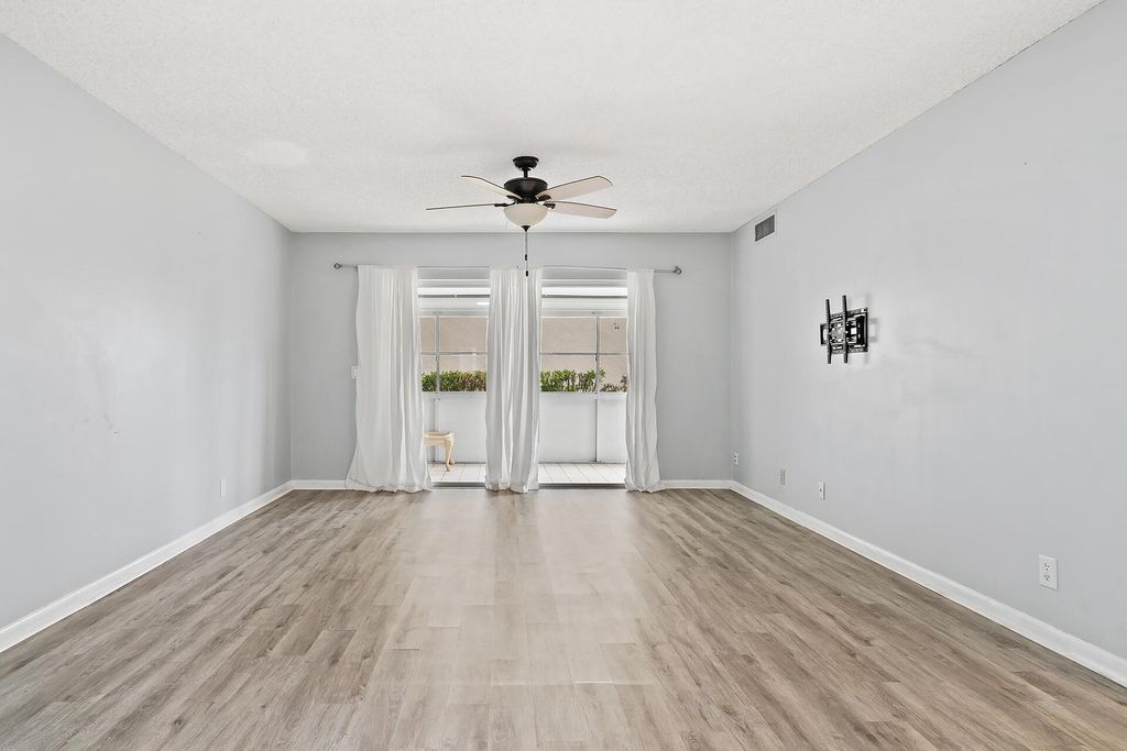 Photo of 12001 Poinciana Boulevard #102, Royal Palm Beach, FL 33411 (MLS # R11123006)