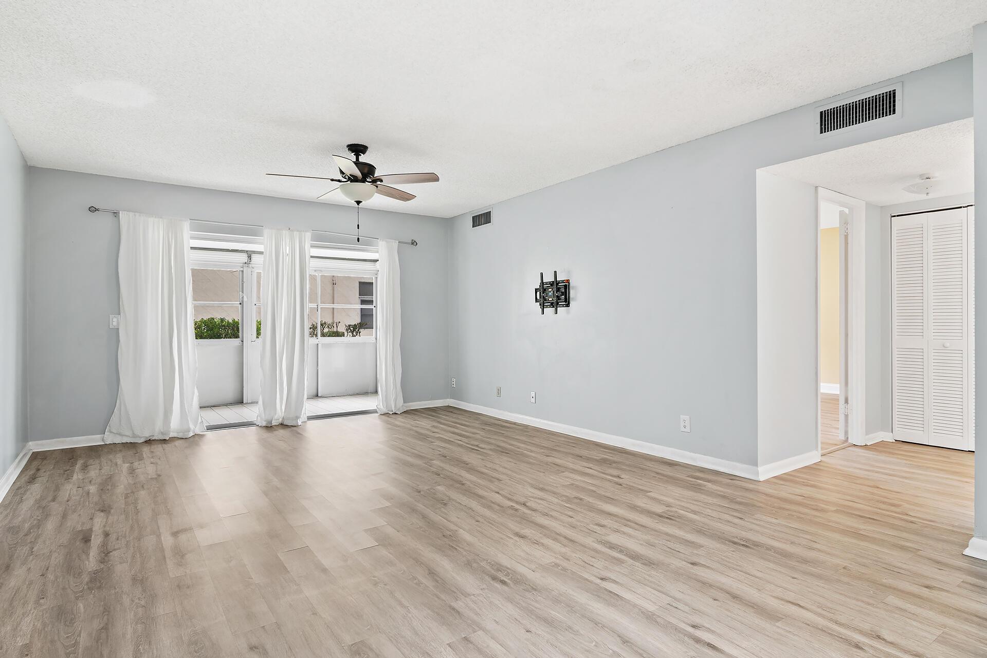 Welcome to this beautifully updated 2-bedroom, 2-bathroom first-floor villa located in the desirable 55+ community in Greenway Village South in Royal Palm Beach. This move-in-ready home features a modern kitchen with granite countertops & sleek cabinetry, along with tile and luxury vinyl plank flooring throughout. The spacious living and dining areas open to a screened patio with peaceful views of the surrounding greenery & waterway, creating a perfect space to relax or entertain. Enjoy the ease of ground-floor living with abundant natural light & a smart, open layout. The community offers fantastic amenities including a clubhouse, pool, fitness center, shuffleboard courts, & social gathering spaces, all just steps from Commons Park with its amphitheater, walking trails, cafe, and more.