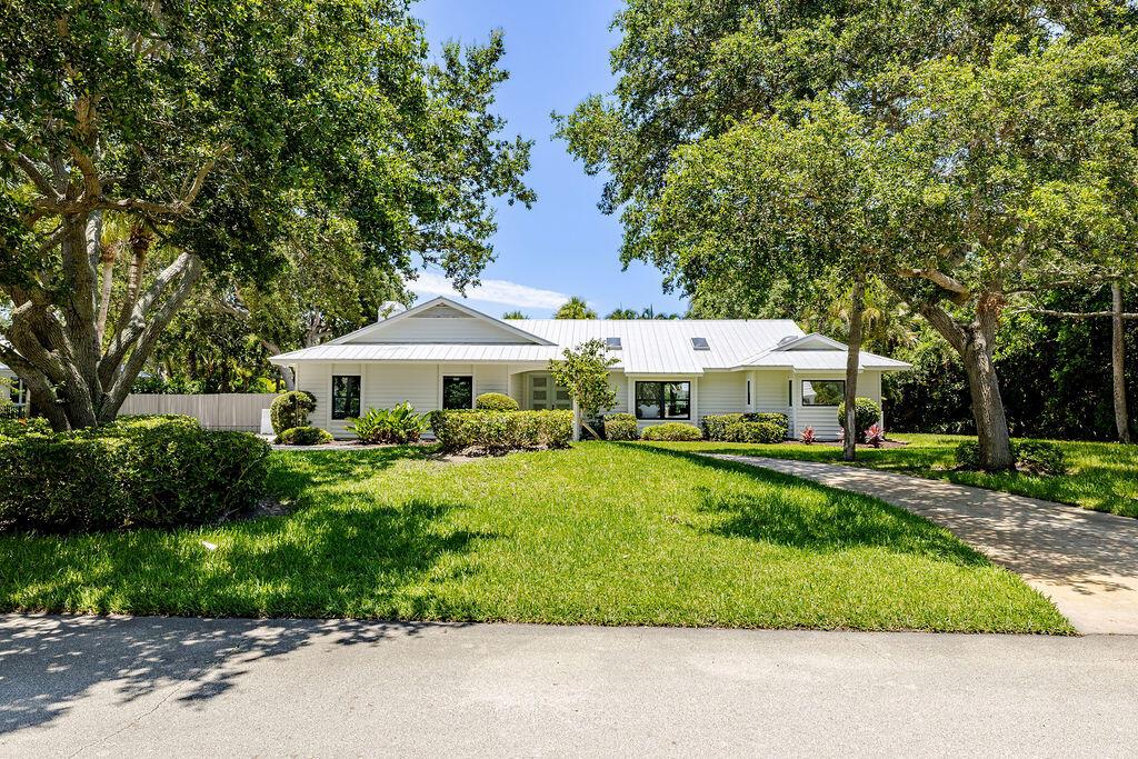 This Oceanside home is beautifully renovated and includes all the amenities you need to enjoy the FLA lifestyle. The property is .52 acres and a short walk to the private beach access. Complete with lush landscaping, a spacious patio/yard, pool, and Summer kitchen. Brand-new features include- impact windows and doors, S/S appliances, cabinets, quartz countertops, tile, int. and ext. paint. The split floor plan is ideal with 3 beds, an office/den and 2.5 baths. Located East of A1A and 1 mile to St. Edwards school w/plenty of dining, shopping, parks, and beaches nearby. Room for a boat/RV too!