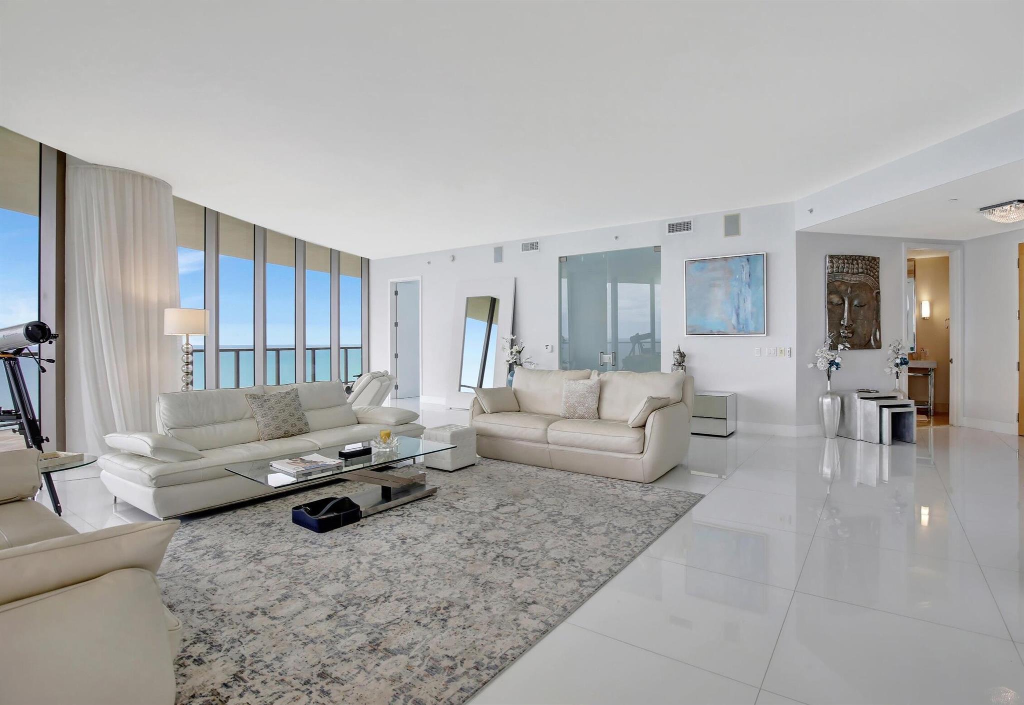 Experience sky-high luxury at the world-renowned St. Regis Bal Harbour. This exceptional penthouse offers breathtaking ocean, Intracoastal, and city views from floor-to-ceiling glass and expansive wraparound terraces. Featuring 3 bedrooms, 4 baths, a designer chef's kitchen, private elevator, and spa-like baths, every detail is crafted for elegance and comfort. Residents enjoy five-star St. Regis service: butler, concierge, Remede Spa, oceanfront pools, dining, and beachside cabanas. Located across from Bal Harbour Shops and moments from Miami's finest destinations. A rare offering at one of South Florida's most prestigious addresses.
