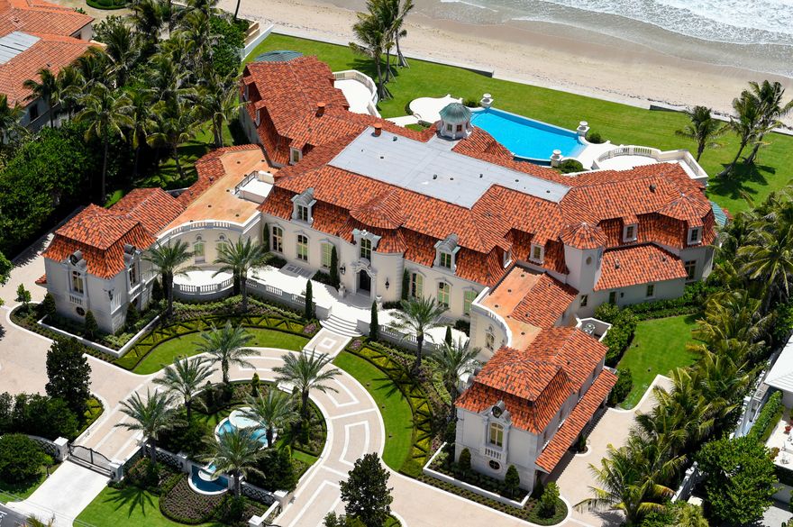 Magnificent Palm Beach direct oceanfront estate with a sprawling 242 feet +/- of beach frontage. Built by Hugh Davis in a French Normandy style, this one-of-a-kind custom estate includes 5 bedrooms, 7 full and 9 half bathrooms along with two fully appointed guest apartments and 8 car garage. The home offers 35,000 +/- square feet of indoor and outdoor living space with ocean views from almost every room due to its perfectly thought out floor plan. An entertainers dream complete with library, home theater, wine room, fitness center, barber shop, and so much more. Breathtaking backyard with outdoor loggia, summer kitchen, infinity pool and spa overlooking the tranquil beaches of the North End.
