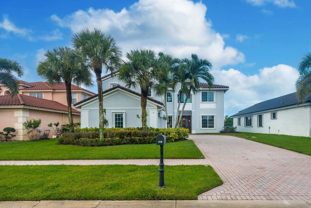 Photo of 112 ISOLA Circle, Royal Palm Beach, FL 33411 (MLS # B26063706)