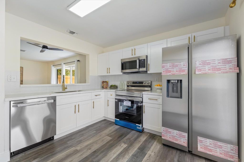 Photo of 5916 Woodland Point Place, Tamarac, FL 33319 (MLS # F10555507)