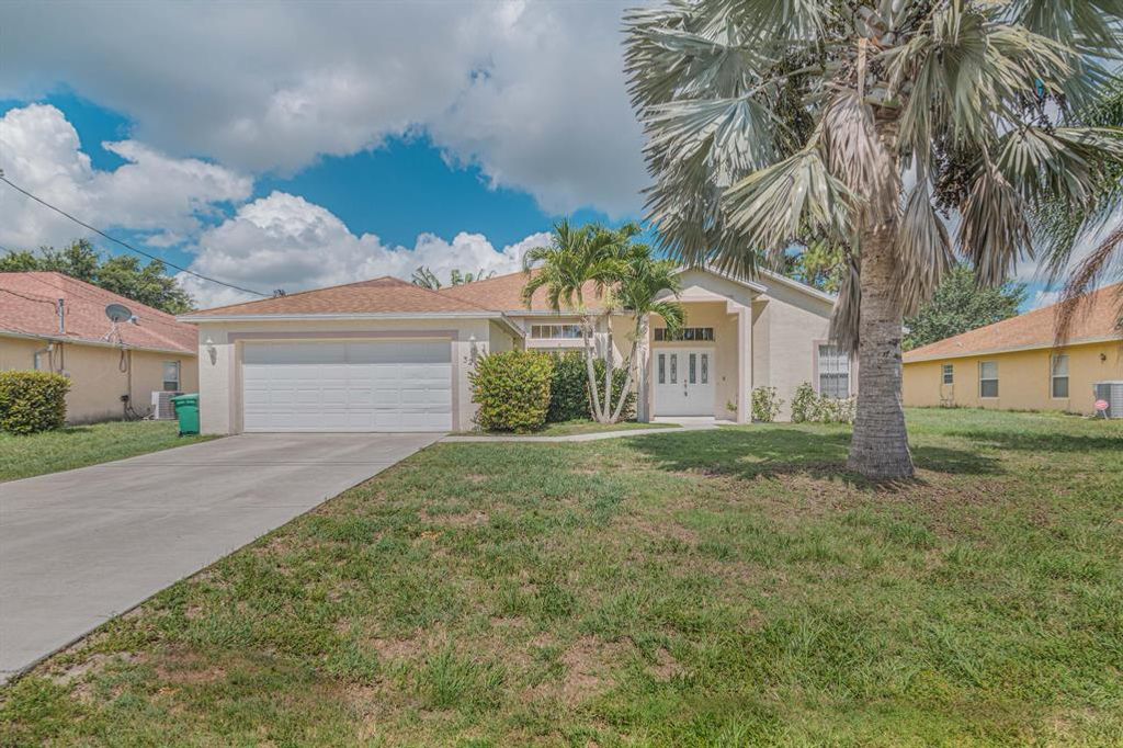 Photo of 3282 SW Escarole Street, Port Saint Lucie, FL 34953 (MLS # R10723012)