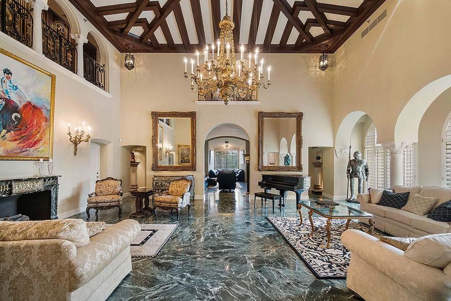 The Alba Suite. This elegant landmark Mediterranean masterpiece, once the private Suite of Spain's Duke & Duchess of Alba, has been meticulously updated to reflect today's lifestyle while preserving its original artistic workmanship and majesty. This two story private elevator home within The Biltmore offers a very sumptuous master suite with a sitting room, his and her bathrooms and extra large closets; four guest bedrooms with en-suite bathrooms, grand staircase, intimate bar, spectacular living room with 20' beamed ceiling, exquisite antique chandeliers with matching sconces, media room, large formal dining room with wood beam ceiling, chef kitchen/breakfast room, and stunning city views. A poolside cabana with a full bathroom, three car garage and two storage units are all included