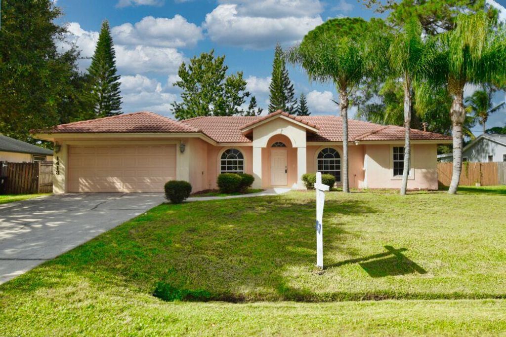 Photo of 1413 SW Medina Avenue, Port Saint Lucie, FL 34953 (MLS # R10832654)