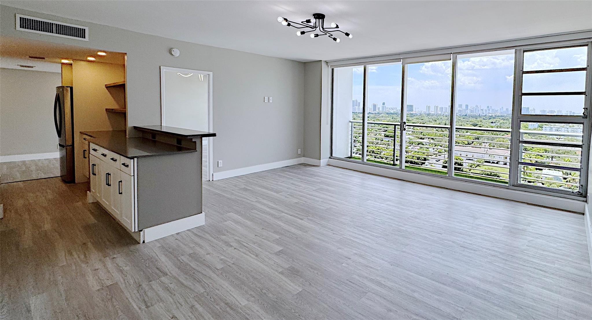 Enjoy living steps to endless dining and entertainment at Home Tower in Downtown Hollywood! This Large 1 Bedroom, 2 full bath condo boasts an oversized Kitchen, expansive views that stretch from downtown Hollywood to the Ocean. Newly Renovated with state of the art appliances, tons of space to entertain on Quartz countertops, In-unit Laundry, community pool and a fitness center. Unit features two separate balconies off of the living room and bedroom through floor to ceiling windows. Great Walkability with Publix, Arts Park around the corner. Hollywood Beach Broadwalk is just over a mile away. Water and Cable included in rent. Parking is surrounding the building and is $175 per year for city permit.