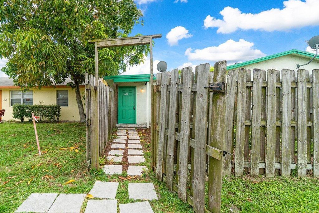 Photo of 3802 Melaleuca Lane #C, Lake Worth, FL 33461 (MLS # R11009661)